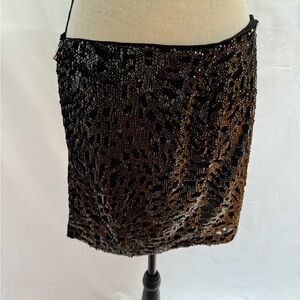 new with tags - black sequins mini skirt. Size small. Cute!